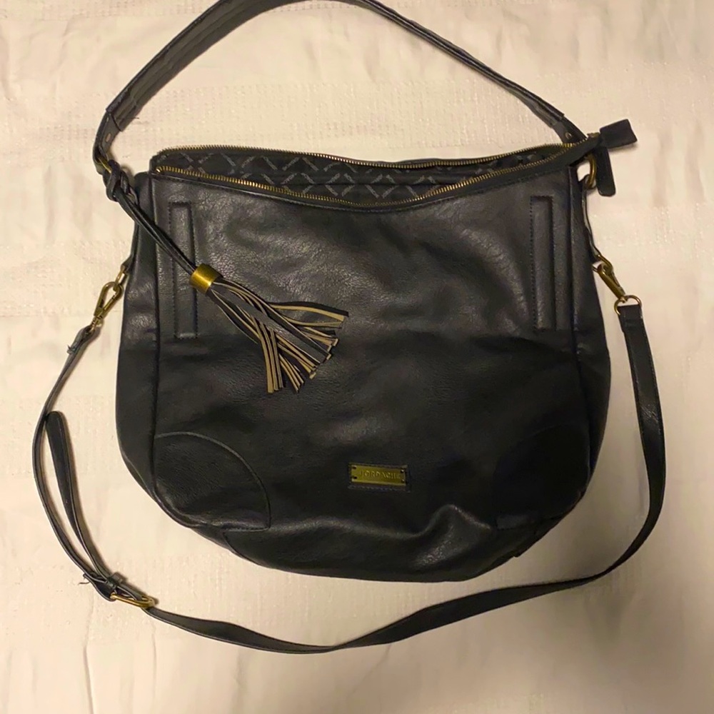 Jordache purse includes crossbody strap.